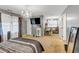 Bright main bedroom with carpet flooring, chandelier, and TV at 4817 Overland Dr, Powder Springs, GA 30127