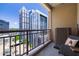 Enjoy the city views from this balcony in the sky featuring outdoor seating and wrought iron railing at 1101 Juniper Ne St # 1216, Atlanta, GA 30309