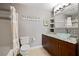 Bathroom complete with granite vanity and see-through sink, shower/tub combo with decorative accents at 1101 Juniper Ne St # 1216, Atlanta, GA 30309