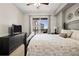 Bedroom featuring a king-sized bed, neutral colors and an outside balcony with scenic views at 1101 Juniper Ne St # 1216, Atlanta, GA 30309