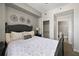 Relaxing bedroom with closet, access to an ensuite bathroom, ceiling fan and decorative wall art at 1101 Juniper Ne St # 1216, Atlanta, GA 30309