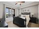 Cozy bedroom features a plush king-sized bed, ceiling fan and an excellent view of the city at 1101 Juniper Ne St # 1216, Atlanta, GA 30309