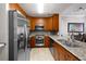 Kitchen with stainless steel appliances, granite countertops, and wood cabinets at 1101 Juniper Ne St # 1216, Atlanta, GA 30309