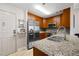 The kitchen features stainless steel appliances, granite countertops, and wooden cabinets at 1101 Juniper Ne St # 1216, Atlanta, GA 30309