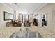 The kitchen island features granite countertops and a stainless steel sink, opening to the living area at 1101 Juniper Ne St # 1216, Atlanta, GA 30309