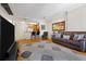 Open living room with wood floors, neutral decor, and view into the kitchen at 1101 Juniper Ne St # 1216, Atlanta, GA 30309