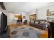 Open living room with wood floors, neutral decor, and view into the kitchen at 1101 Juniper Ne St # 1216, Atlanta, GA 30309