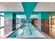 Indoor pool with vibrant colors, tiled accents, and lane markers, perfect for year-round fitness and recreation at 1101 Juniper Ne St # 1216, Atlanta, GA 30309