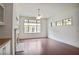 Bright and spacious living room with hardwood floors, a fireplace, and large windows, providing natural light at 1585 Oak Meadows Ln, Cumming, GA 30041