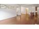 Open-concept living area with hardwood flooring, showcasing kitchen access and natural light at 1585 Oak Meadows Ln, Cumming, GA 30041