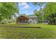 A spacious backyard with a large screened-in porch and a storage shed at 3034 Barksdale Cir, Atlanta, GA 30344