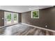 Finished basement with neutral paint, resilient floors, recessed lighting and a convenient access to the backyard at 3034 Barksdale Cir, Atlanta, GA 30344