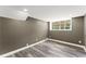 Finished basement area with resilient flooring, neutral paint, a window, and recessed lighting at 3034 Barksdale Cir, Atlanta, GA 30344