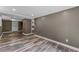 Basement area with neutral paint, modern floors, recessed lights, and access to more areas at 3034 Barksdale Cir, Atlanta, GA 30344