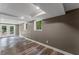 Spacious finished basement with durable flooring, neutral paint, double doors to the exterior and multiple windows at 3034 Barksdale Cir, Atlanta, GA 30344