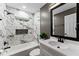 Beautiful bathroom with a tub, marble tiled walls, and modern fixtures offering a spa-like experience at 3034 Barksdale Cir, Atlanta, GA 30344