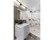 Beautiful bathroom featuring marble tile, a stone tiled shower floor, and modern fixtures at 3034 Barksdale Cir, Atlanta, GA 30344