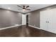 Comfortable bedroom with wood floors, ceiling fan, and closet space at 3034 Barksdale Cir, Atlanta, GA 30344