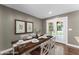 Sunlit dining area with french doors leading to the outside, virtually staged at 3034 Barksdale Cir, Atlanta, GA 30344