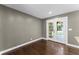Dining room with hardwood floors, neutral walls, and french doors leading to the backyard at 3034 Barksdale Cir, Atlanta, GA 30344