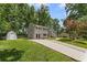 Charming two-story home with a long driveway and well-manicured lawn at 3034 Barksdale Cir, Atlanta, GA 30344