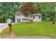 Beautifully landscaped front yard with a charming two-story home at 3034 Barksdale Cir, Atlanta, GA 30344