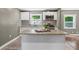 Bright kitchen featuring an island with seating and granite countertops at 3034 Barksdale Cir, Atlanta, GA 30344