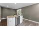 Kitchen island with granite countertops and stainless steel appliances at 3034 Barksdale Cir, Atlanta, GA 30344