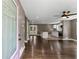 Inviting living room with hardwood floors seamlessly connecting to a modern kitchen with a center island at 3034 Barksdale Cir, Atlanta, GA 30344