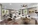 Staged living room highlighting hardwood floors and an open layout with an adjacent kitchen and dining area at 3034 Barksdale Cir, Atlanta, GA 30344