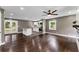 Open-concept living space showcasing hardwood floors, a stylish kitchen, and seamless flow to the outdoors at 3034 Barksdale Cir, Atlanta, GA 30344