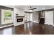 Spacious living room with fireplace, hardwood floors, and staircase access to upper level of the home at 3034 Barksdale Cir, Atlanta, GA 30344