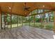 Spacious screened porch with wood paneled ceiling and tiled floors overlooking the backyard at 3034 Barksdale Cir, Atlanta, GA 30344