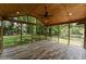 Picturesque screened porch with wood paneled ceiling, perfect for outdoor enjoyment at 3034 Barksdale Cir, Atlanta, GA 30344