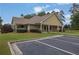 Community clubhouse with well-manicured landscaping and ample parking at 4218 Sandy Branch Dr, Buford, GA 30519