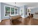 Bright dining area with a large window overlooking the backyard, perfect for casual meals and entertaining guests at 4218 Sandy Branch Dr, Buford, GA 30519