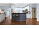 Kitchen with a breakfast bar, modern appliances, and hardwood floors at 4218 Sandy Branch Dr, Buford, GA 30519