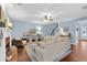 Comfortable living room with a white sofa, fireplace, and built-in shelving at 4218 Sandy Branch Dr, Buford, GA 30519