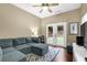 Living room with a comfortable sectional sofa and a view of the backyard at 4218 Sandy Branch Dr, Buford, GA 30519