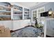 Cozy office featuring built-in shelving, a comfortable desk setup, and soft blue walls at 4218 Sandy Branch Dr, Buford, GA 30519
