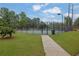 Community tennis court features a fenced in court with lush green surroundings at 4218 Sandy Branch Dr, Buford, GA 30519
