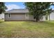 Backyard featuring well-maintained grass and a patio at 7008 Glen Valley Way, Fairburn, GA 30213