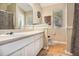 Bathroom featuring a large vanity, parquet flooring, and neutral decor at 7008 Glen Valley Way, Fairburn, GA 30213