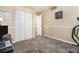 Bedroom featuring neutral paint, plush carpet, and a closet at 7008 Glen Valley Way, Fairburn, GA 30213