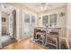 Bright breakfast nook featuring a cozy table with seating, french doors, and neutral tones at 7008 Glen Valley Way, Fairburn, GA 30213