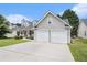 Attractive home showcasing a spacious driveway and a convenient two-car garage at 7008 Glen Valley Way, Fairburn, GA 30213