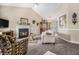 Inviting living room with a cozy fireplace, plush carpeting, and comfortable seating at 7008 Glen Valley Way, Fairburn, GA 30213