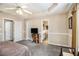 Spacious main bedroom features a tray ceiling, carpeted floors, and neutral decor at 7008 Glen Valley Way, Fairburn, GA 30213