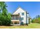 Back exterior with screened-in porch and manicured lawn and fence at 2235 Birchtree Way, Marietta, GA 30062