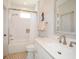 Bathroom featuring a shower-tub combination with marble-like tile and a light-colored vanity at 2235 Birchtree Way, Marietta, GA 30062